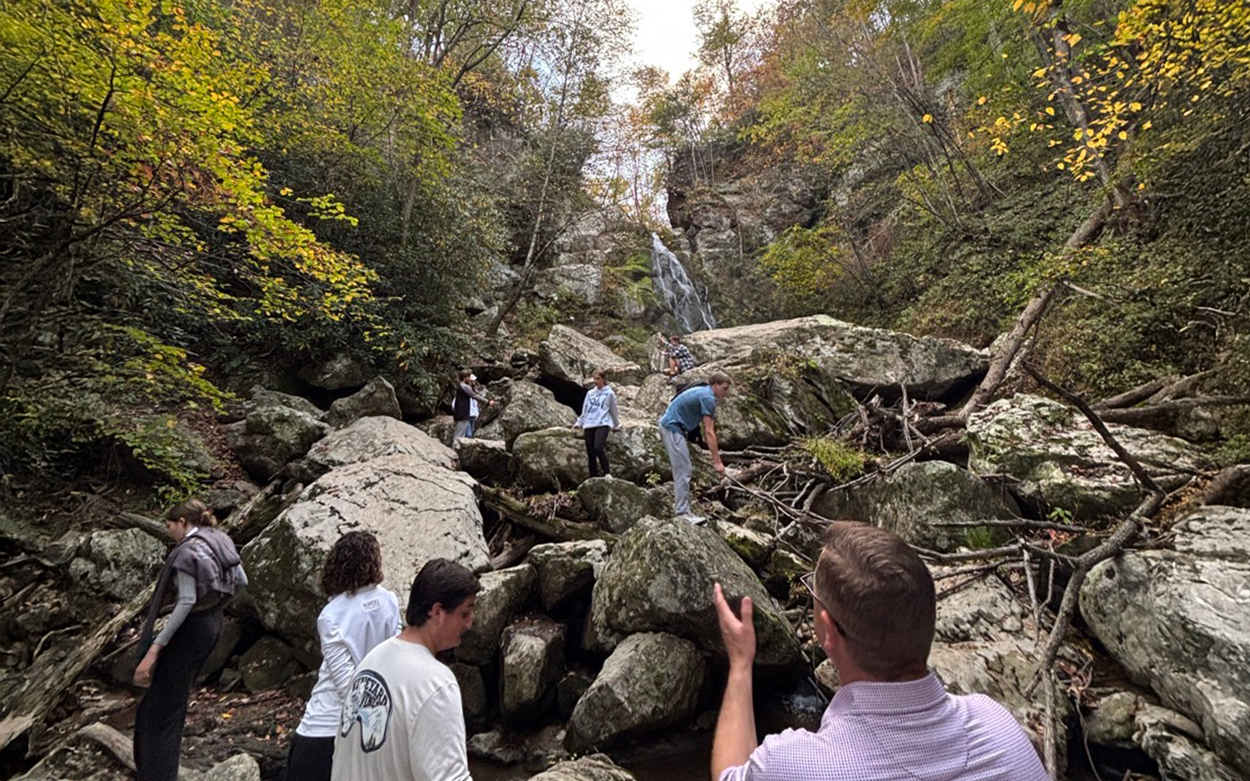 Students hiking on rocks