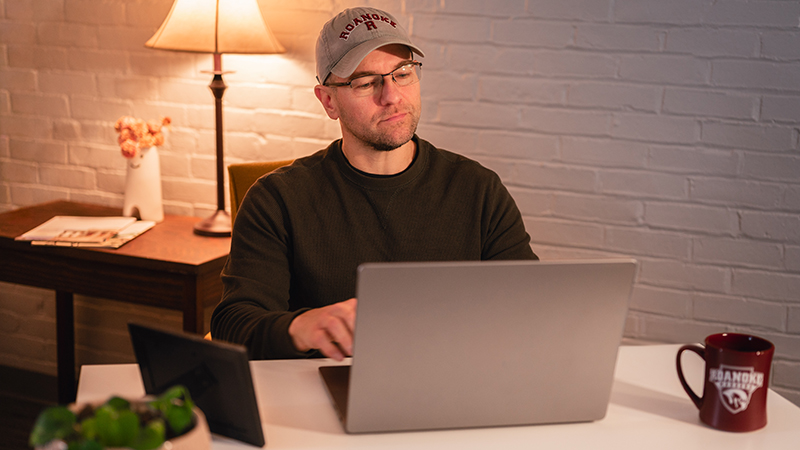 student looking at a laptop