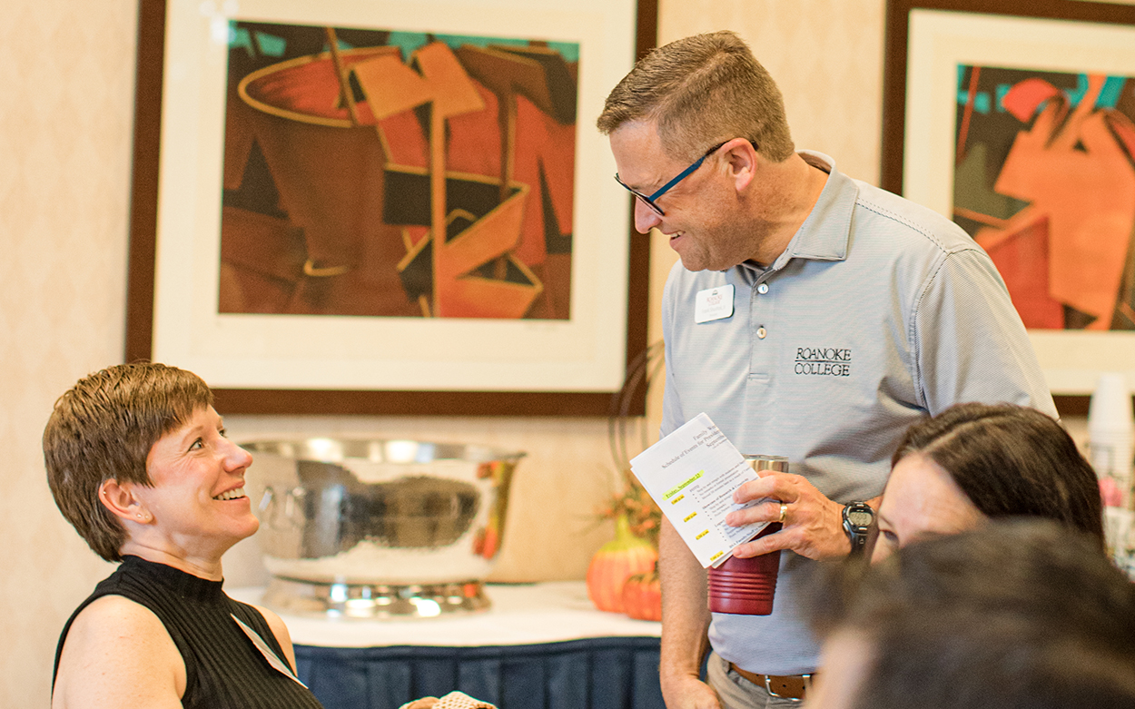 President Sushok talking to a parent
