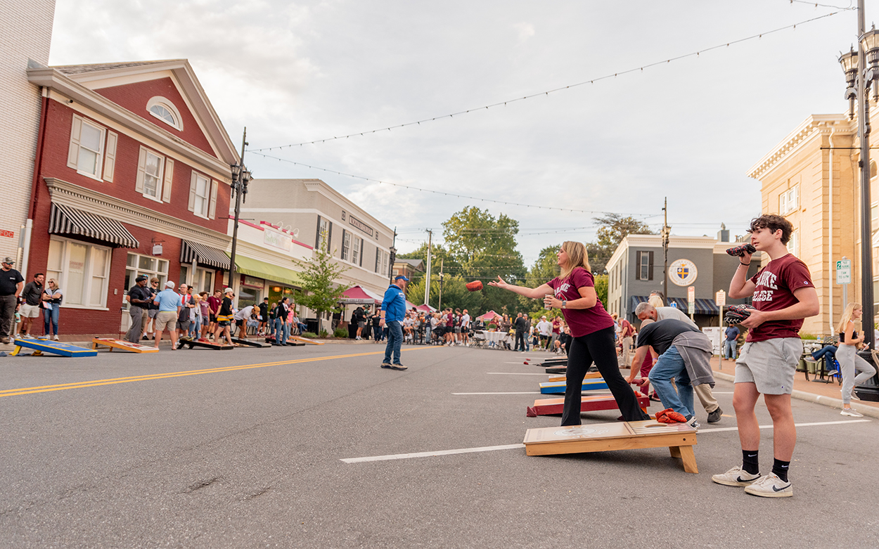 Families Playing Cornhole