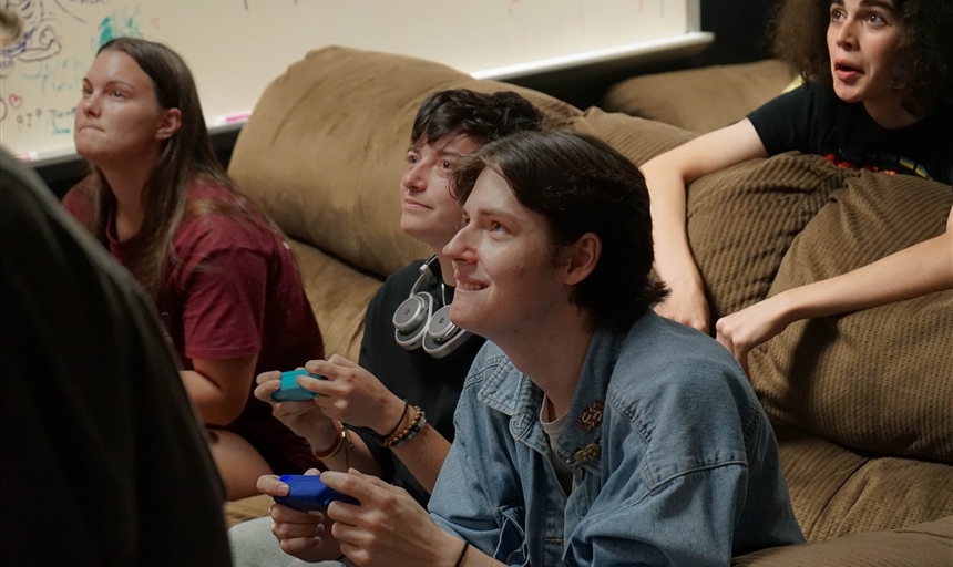 students playing Mario Kart in the gameroom