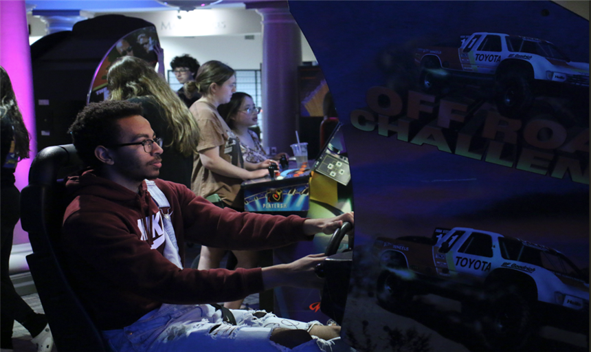 students playing arcade games 