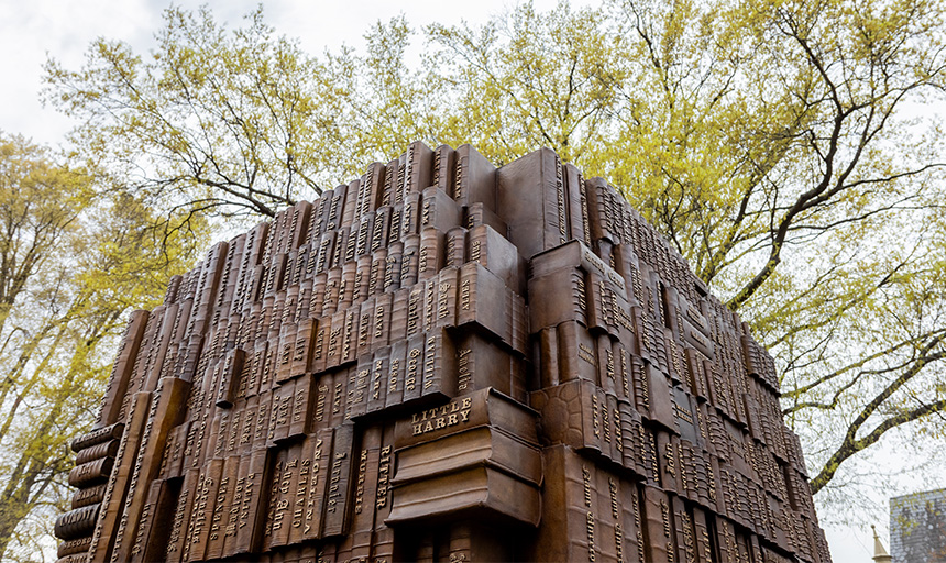 A bronze memorial sculpted in the shape of record books and engraved with people's names