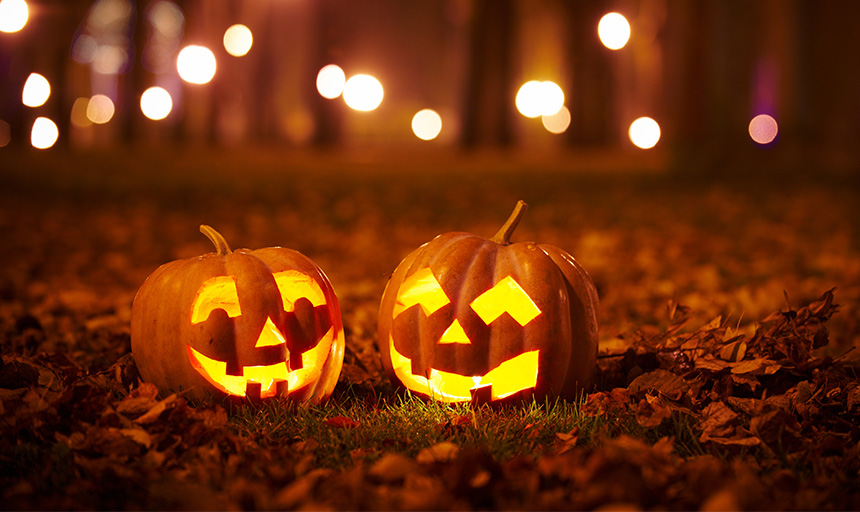 Jack o lanterns glowing in the woods