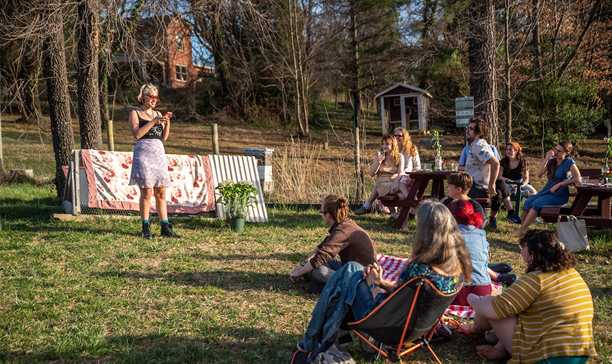students in the garden reading poetry