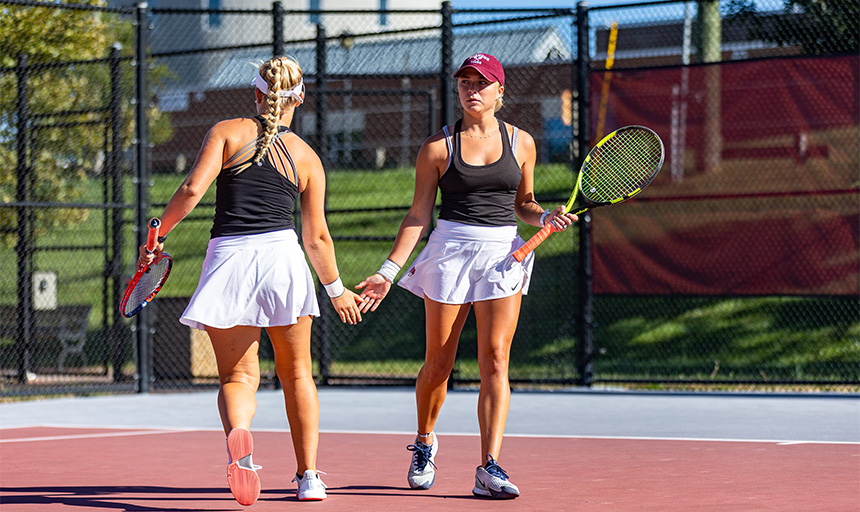 two women on tennis court