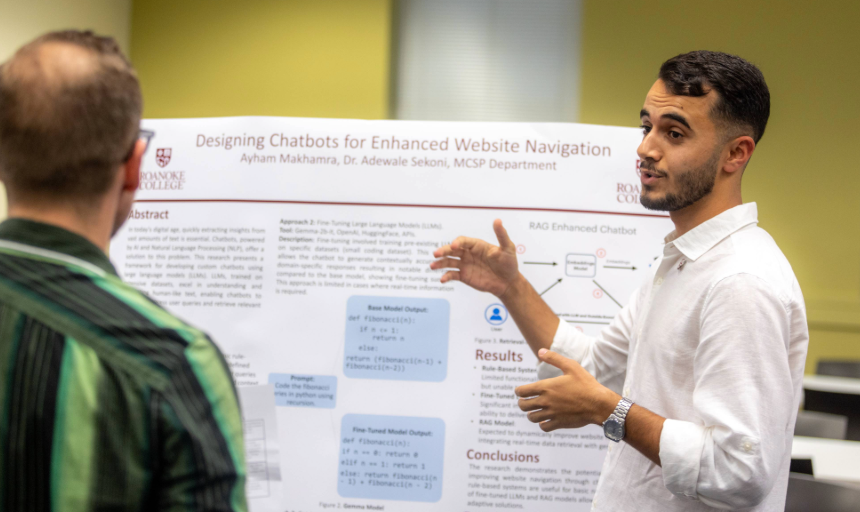 Student answering questions during a research poster presentation