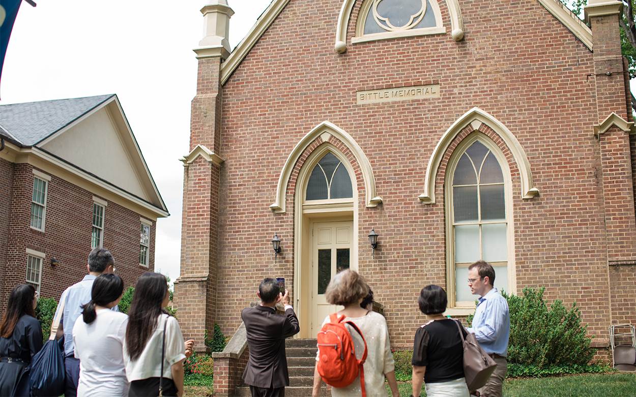 Korean visitors look at Bittle Memorial Hall in a tour