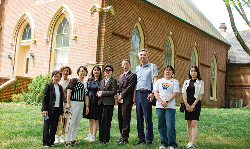Kim family delegation stands in front of Bittle Memorial