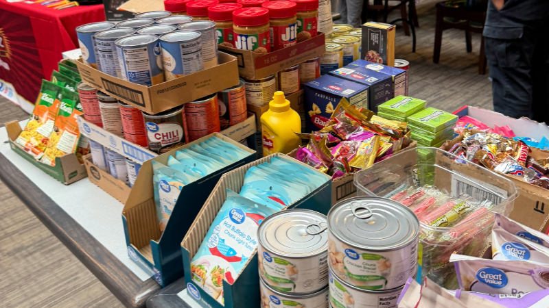 Stacks of canned and packaged food at a donation drive