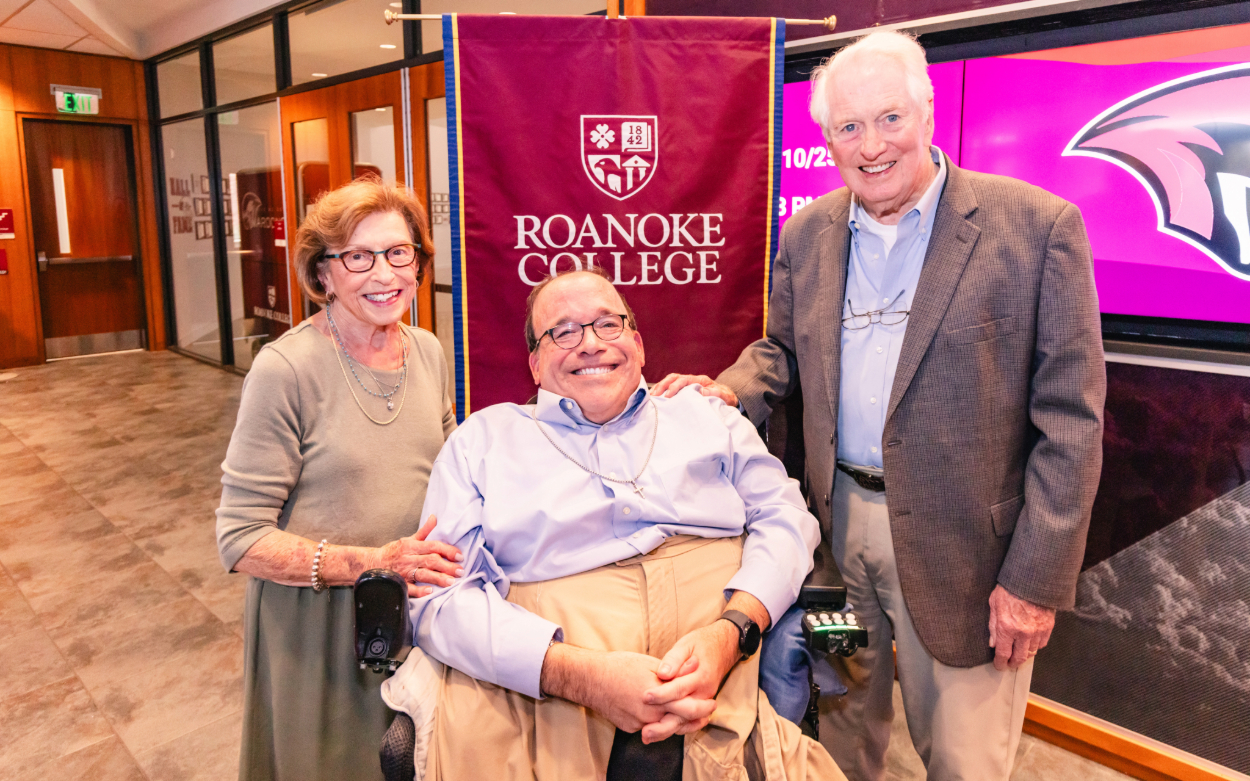 Kent Shiner poses with his parents in the lobby of the Cregger Center after a presentation about a new scholarship named in his honor.
