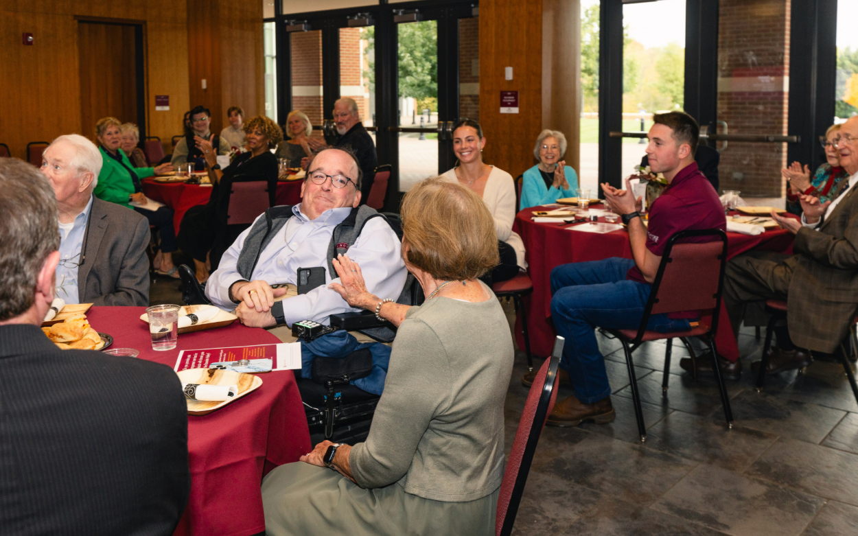Linda Shiner pats her son Kent Shiner's arm after the announcement that a disability studies scholarship was created in his name. 
